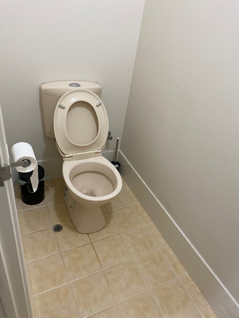 Installation. Picture captures the room before JMT Plumbing installs a new toilet and tiles.