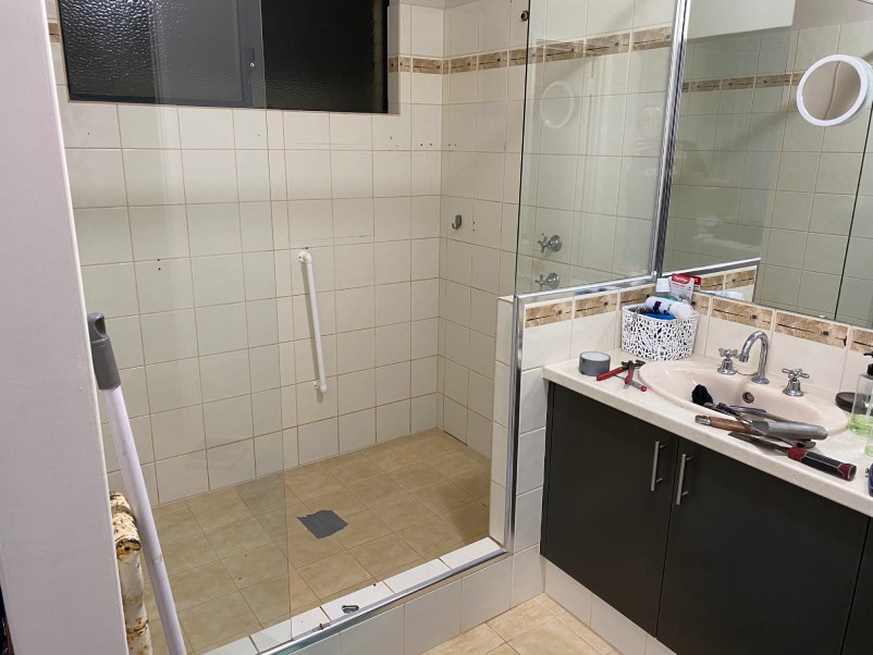 The before shot of a bathroom prior to renovations by JMT Plumbing.